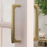 Brass Door Pull installed on a door