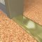 NGP 425 Utility Thresholds in BR Finish applied to floor of door entrance