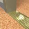NGP 613 Utility Threshold in BR Finish applied to floor of door entrance