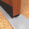 NGP 92NWH Door Shoe Sweep, U Shaped Aluminum with 2" Kickplate and .75" Neoprene and Nylon Brush Seals in DKB Finish applied to wooden door