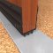 NGP 99T Door Shoe Sweep, U Shaped Aluminum with 2.75" Rigid Kickplate and .6875" Thermoplastic Triple Fin Seal in DKB Finish applied to bottom of door