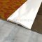 Clear Anodized Carpet Edge Divider on floor