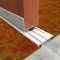 Pemko 236 Carpet Divider on Carpet Floor with Wooden Door