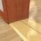 Pemko 256x6 Gold Threshold on Wooden Floor