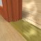 Brass Door Sadlle installed on a floor
