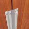 Seals the gap between pair of double doors