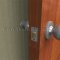 Rockwood 405 Solid Cast Door Stop installed on a wall With Concave Bumper Applied 