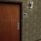 Rockwood ADA Tactile Sign with Braille, Unisex Restroom and Handicap Accessible in US26 finish applied to Interior Door
