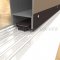 L Shaped Door Shoe 154 with Pile Brush Seal in Dark Bronze Anodized Finish Applied to Metal Door