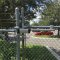 Locinox SAMSON-2 Gate Closer installed on chain link fence